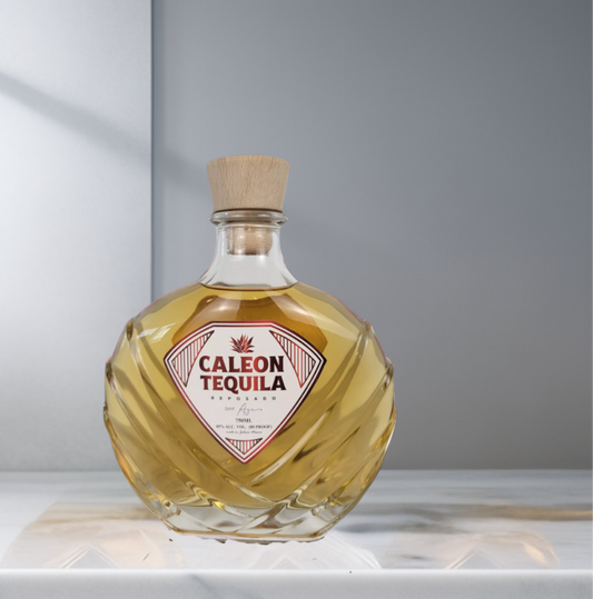 Caleon Reposado Tequila bottle with diamond-shaped label and wooden cork stopper on marble surface