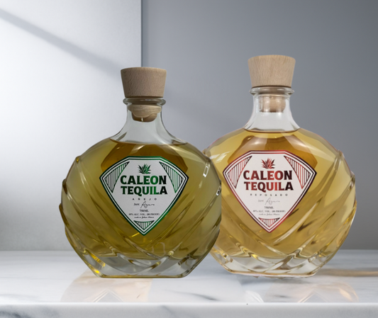 Caleon Tequila Reposado & Añejo Bundle featuring two uniquely shaped bottles with wooden caps on a marble surface